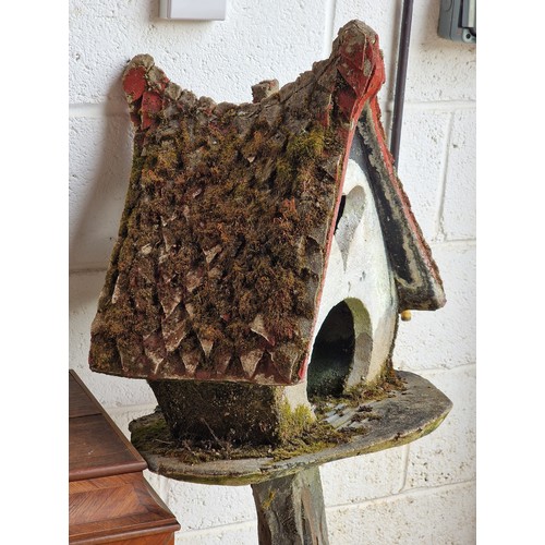 26 - Two naive folk art reconstituted stone dovecots with painted detail, largest H 132cm x W 50cm (2)