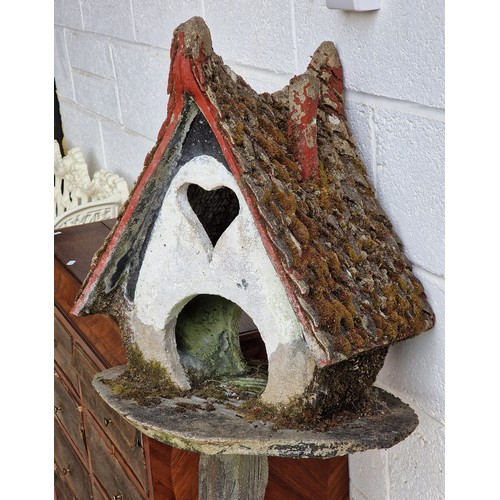 26 - Two naive folk art reconstituted stone dovecots with painted detail, largest H 132cm x W 50cm (2)