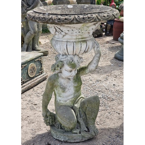 34 - Pair of weathered reconstituted stone garden urns with lobed bowls and foliate swag detail, raised o... 