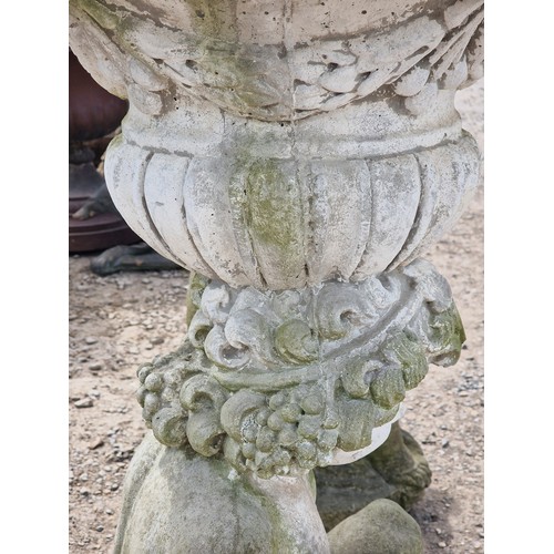 34 - Pair of weathered reconstituted stone garden urns with lobed bowls and foliate swag detail, raised o... 