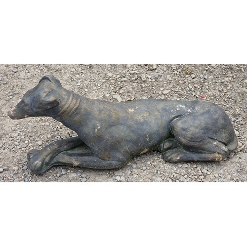 36 - Reconstituted stone bronzed effect statue of a recumbent hound, H 25cm x W 57cm x D 15cm