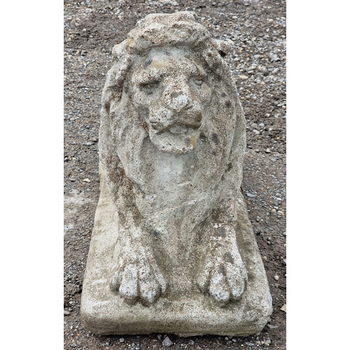 41 - Reconstituted stone statue of a recumbent lion, H 47cm x W 31cm x D 70cm