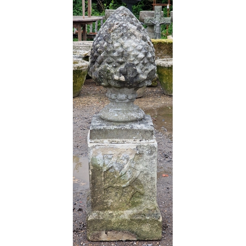51 - Set of five weathered reconstituted stone pineapple finials raised on square cut plinths with fielde... 