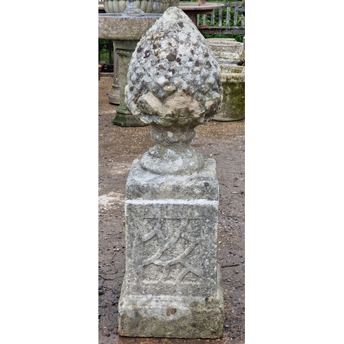 51 - Set of five weathered reconstituted stone pineapple finials raised on square cut plinths with fielde... 