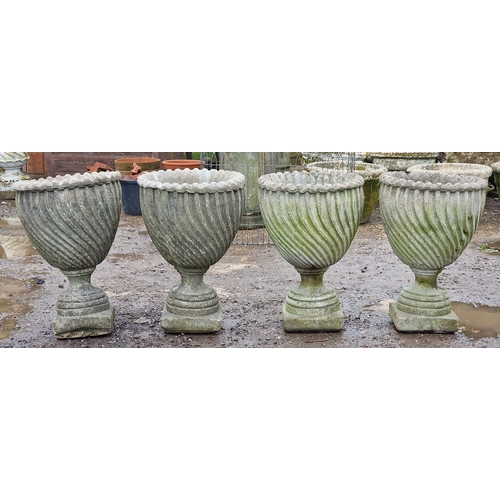 53 - Set of four weathered reconstituted stone garden urns with spiral twist bowls, H 65cm x W 46cm (4)