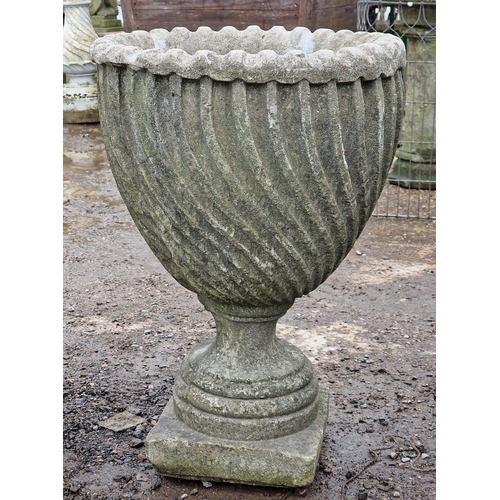 53 - Set of four weathered reconstituted stone garden urns with spiral twist bowls, H 65cm x W 46cm (4)