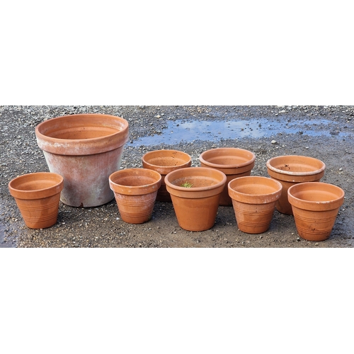 58 - Nine terracotta pots of various size and design, largest H 41cm x W 48cm (9)