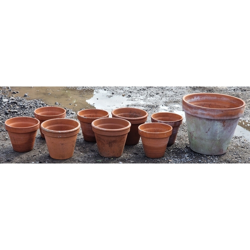 58 - Nine terracotta pots of various size and design, largest H 41cm x W 48cm (9)