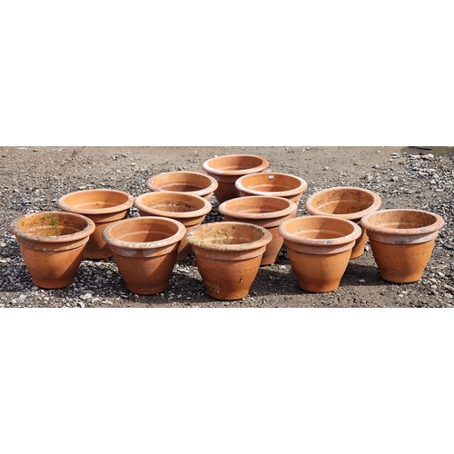 60 - Set of twelve terracotta pots with incised Greek key detail, H 23cm x W 31cm (12)