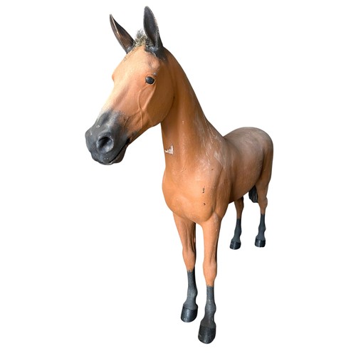 55 - An enormous life-sized fibreglass horse, with painted matt brown finish, H 225cm x L 250cm approx.