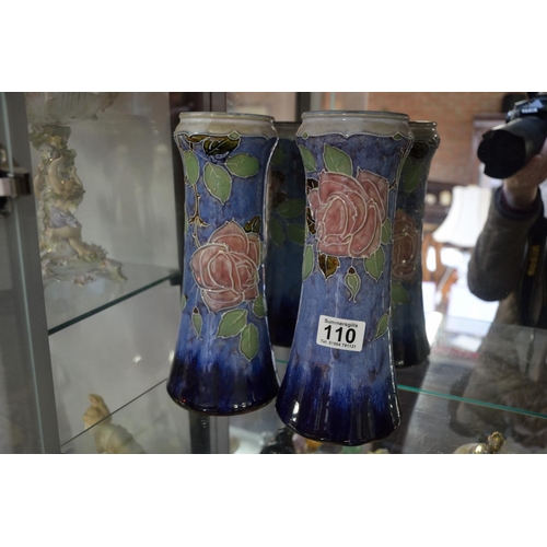 110 - Pair of floral rose and blue Royal Doulton vases