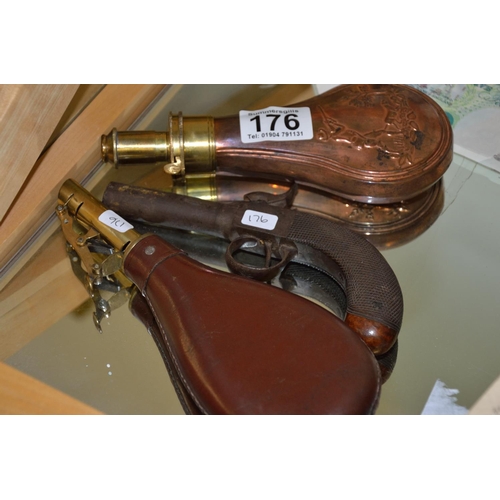 176 - Trio of powder/shot flasks and pistol in G & JW Hawkesley