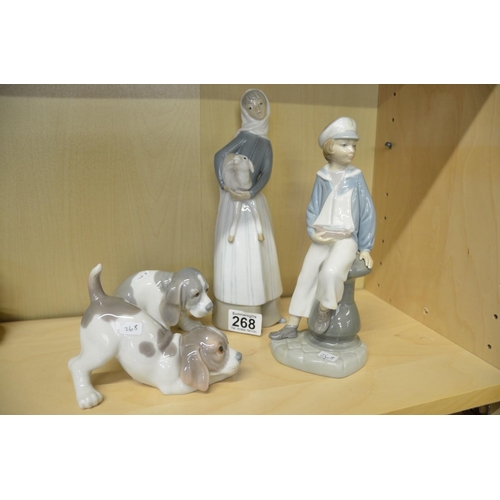 268 - Group of four Lladro figures and puppies