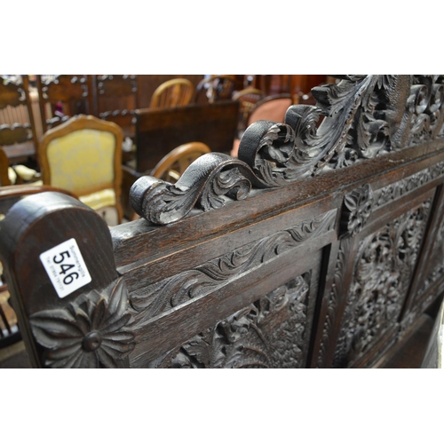 546 - Heavily carved hall seat