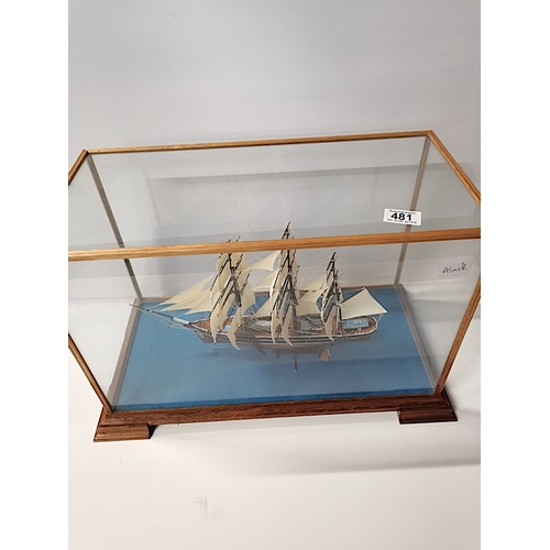 481 - A small Model of Clipper sailing Ship in Glass Case