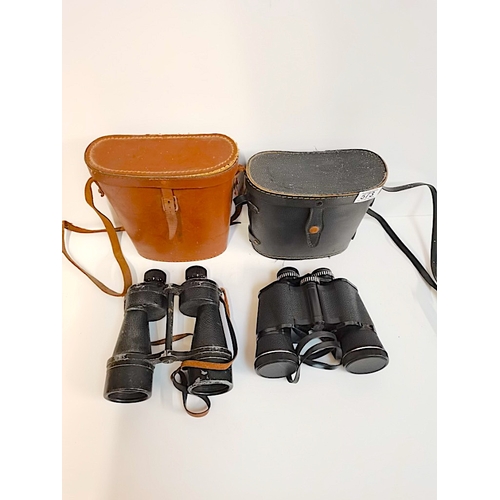 573 - 2 pairs of cased Binoculars