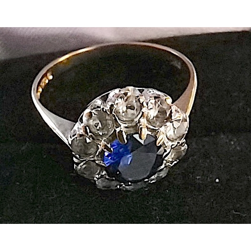 693 - 9ct gold 375 blue stone centre surrounded by 10 small white stones set in white gold size P