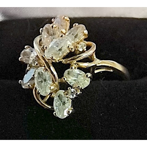 698 - 14k gold designer ring with 12 white stones set in yellow claws size S