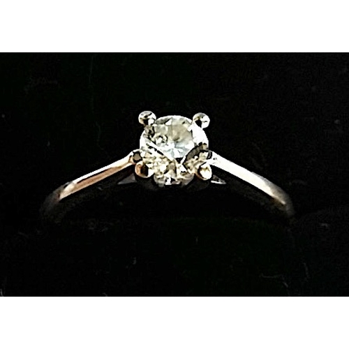 702a - Platinum ring with 0.33solitaire diamond set raised on 4 claws very bright clear stone size L excell... 