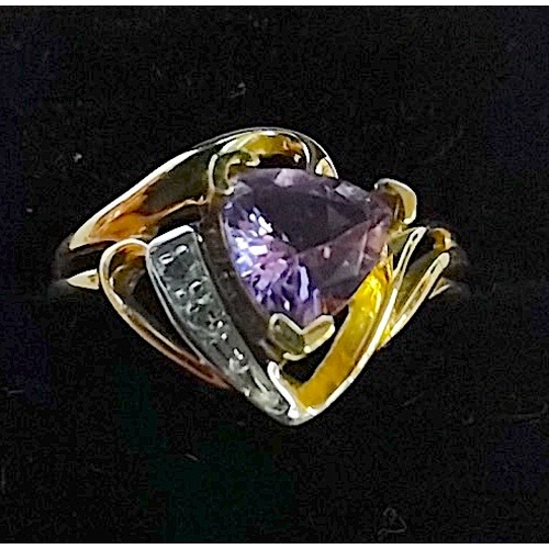 702f - 10ct gold designer ring purple heart shaped centre stone with a shoulder of white stones set in whit... 