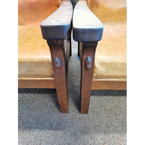 915 - A pair of Mouseman oak smoking chairs with leather seats