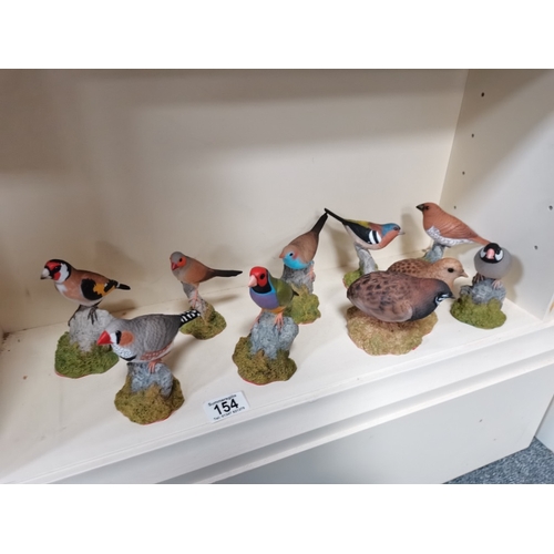 154 - 9 misc bird figures