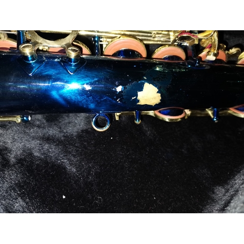 489 - A snazzy coloured blue coloured Saxophone by Stagg in case  slight chips to rear paint work oth... 