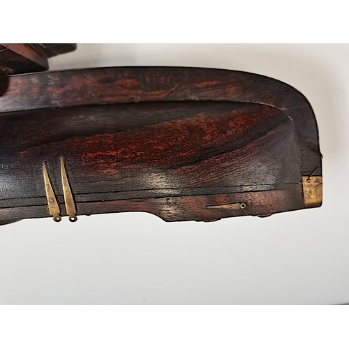 509 - A rosewood 50cm Model of a sailing canoe with letter from National Martime Museum confirming it is p... 