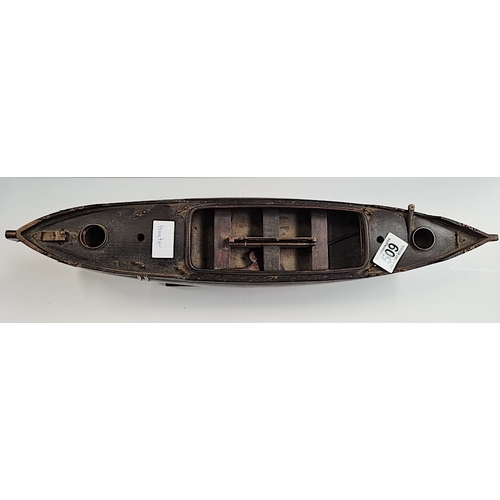 509 - A rosewood 50cm Model of a sailing canoe with letter from National Martime Museum confirming it is p... 