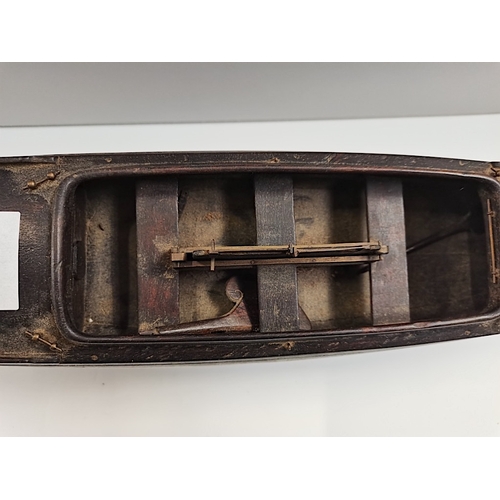 509 - A rosewood 50cm Model of a sailing canoe with letter from National Martime Museum confirming it is p... 