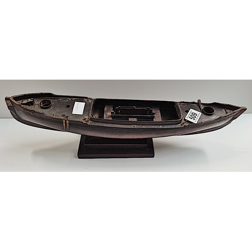 509 - A rosewood 50cm Model of a sailing canoe with letter from National Martime Museum confirming it is p... 