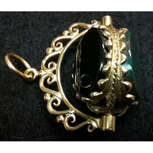 696 - 9ct gold 375 fob very ornate swivel with 3 coloured stones good condition