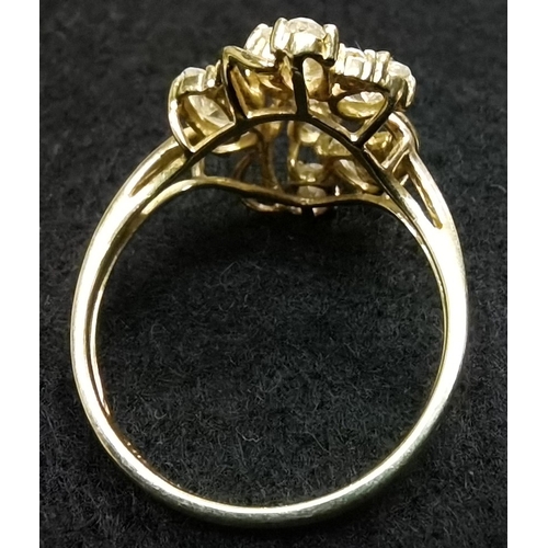 698 - 14k gold designer ring with 12 white stones set in yellow claws size S