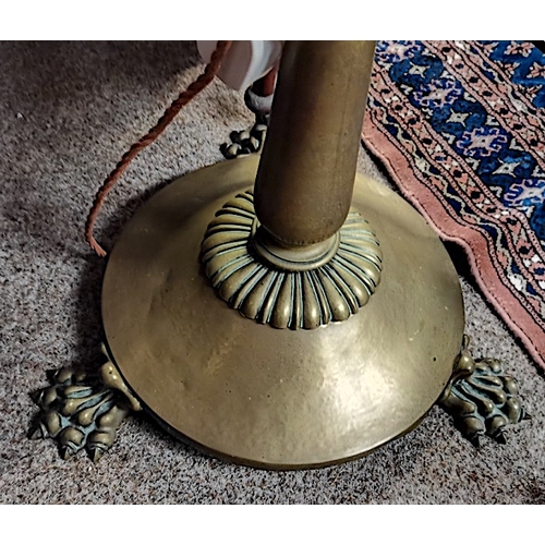 886 - Brass standard lamp with claw feet