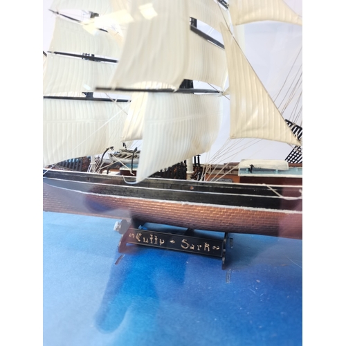 481 - A small Model of Clipper sailing Ship in Glass Case