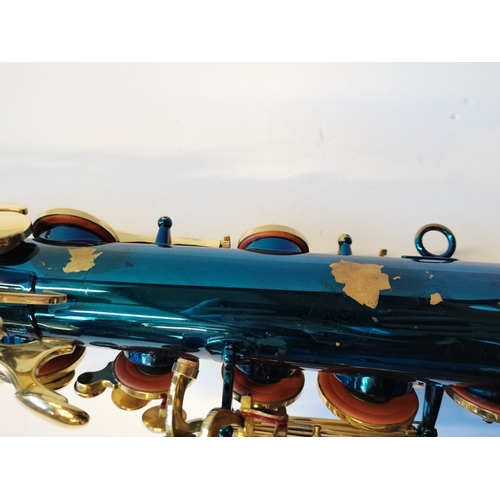 489 - A snazzy coloured blue coloured Saxophone by Stagg in case  slight chips to rear paint work oth... 