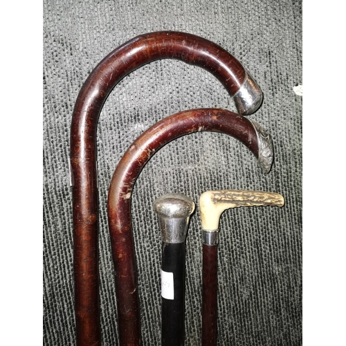 469 - 4 Silver Top Walking Sticks & Canes