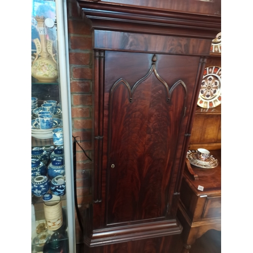 822 - An 8 day longcase clock with painted face by R Lawson Hindley