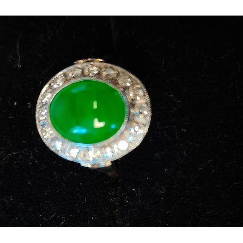 675b - 18ct ring yellow gold with 5ct Coubochon green centre stone encrusted with white diamonds size N