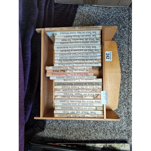 242 - 25 x Beatrix Potter books in shelf