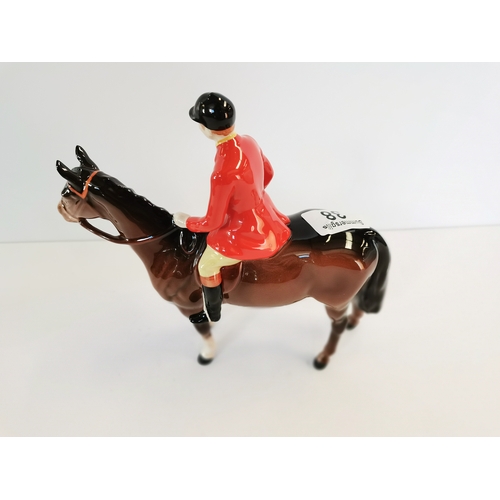 38 - Beswick huntsman standing four square on brown horse