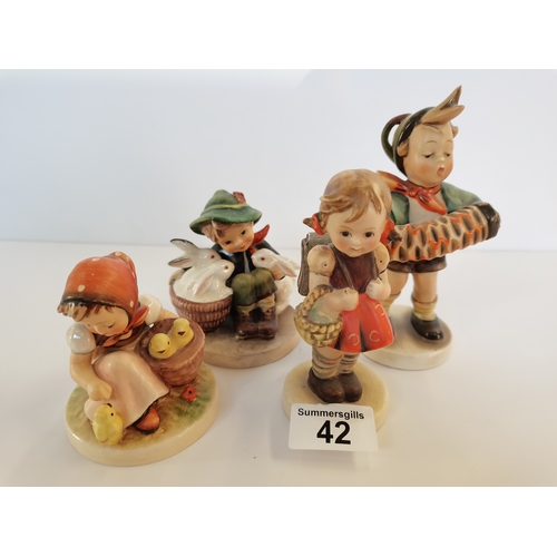 42 - 4 Hummel figures boy with rabbits, girl with chickens, girl with basket on arm and boy with concerti... 