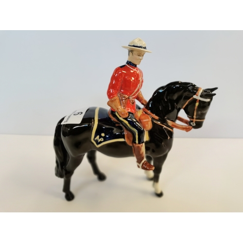 9 - Beswick Canadian Mountie on black horse