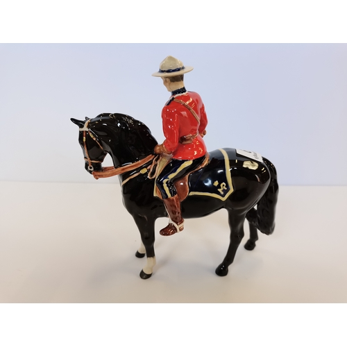 9 - Beswick Canadian Mountie on black horse