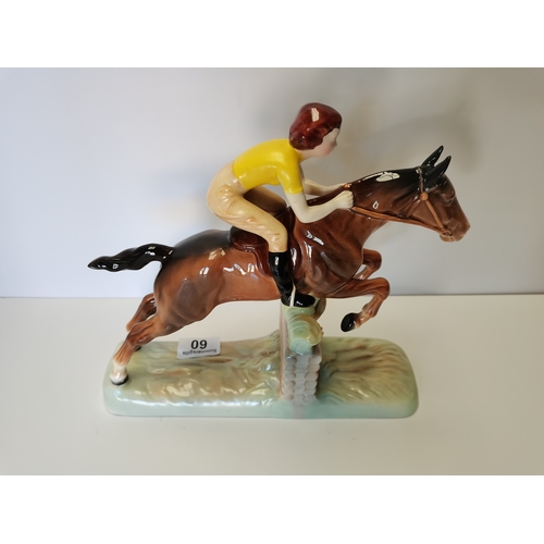 60 - Beswick Girl with yellow jumper jumping fence on brown horse