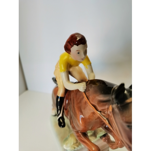 60 - Beswick Girl with yellow jumper jumping fence on brown horse