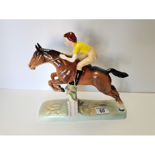 60 - Beswick Girl with yellow jumper jumping fence on brown horse