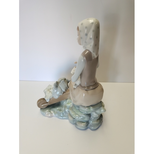 68 - Lladro girl with wheelbarrow and lamb on knee