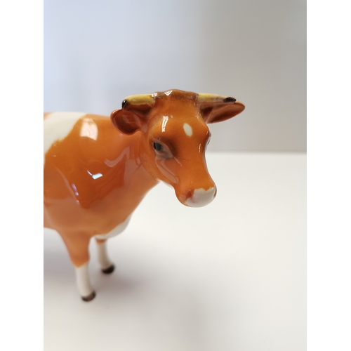 73 - First Version Beswick Guernsey Cow with Second version Guernsey cow (small restoration on both)