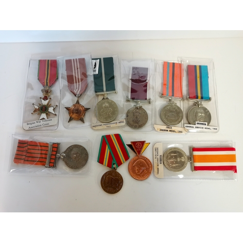 645 - Collection of foreign medals India, Pakistan, West Germany, etc. Some named to recipients